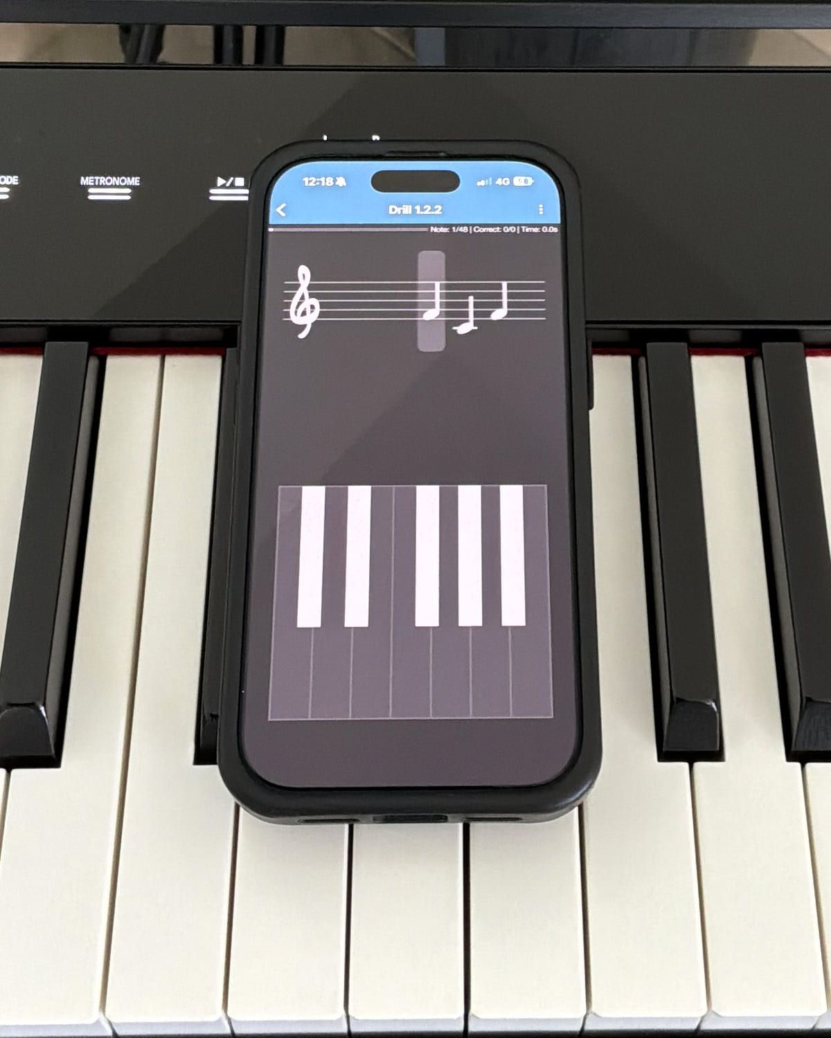 A Complete Music Reading Trainer drill in progress on the same phone: three notes on a treble staff above an on-screen piano keyboard used to answer, with a counter reading note 1 of 48.